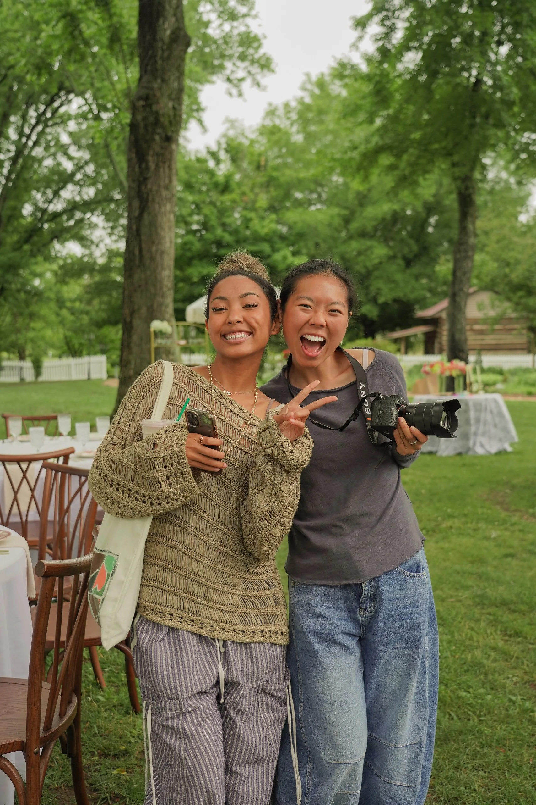 Two friends smiling together outside.